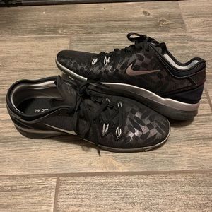 Black reflective Nike running shoes